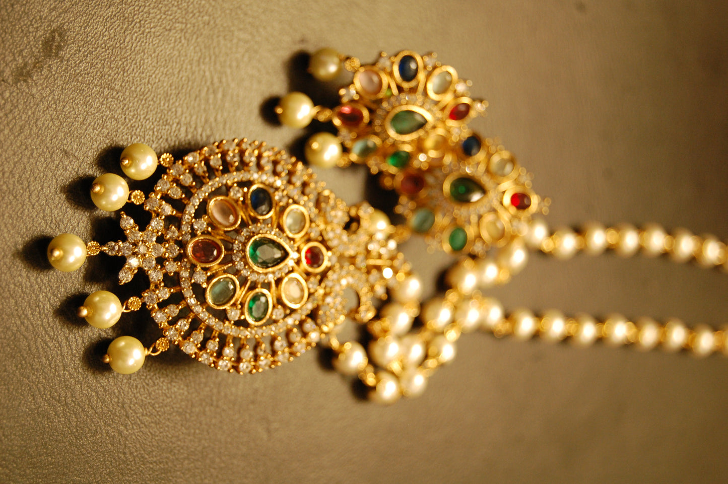 INDIAN MULTI JEWELLED PENDENT IN PEARL STRING