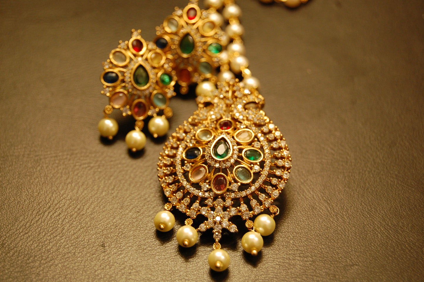 INDIAN MULTI JEWELLED PENDENT IN PEARL STRING